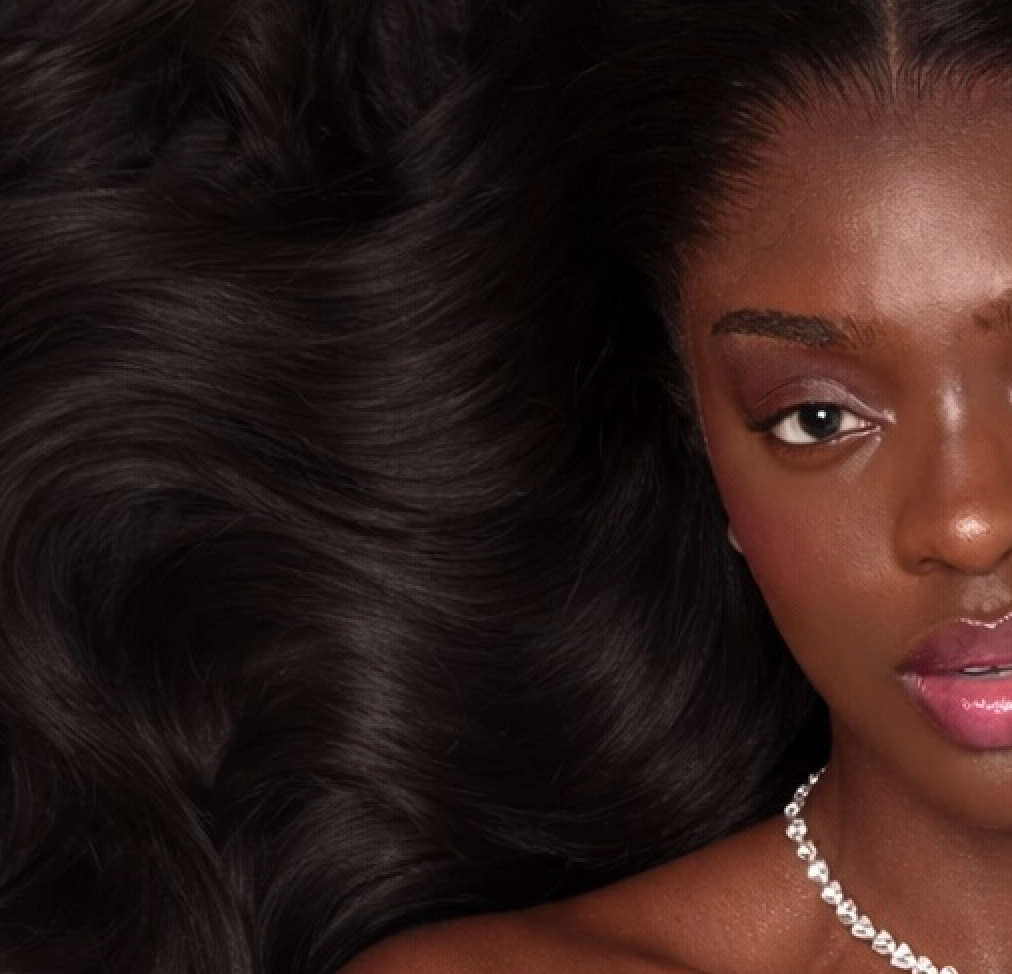 Glossy black waves framing a model’s face