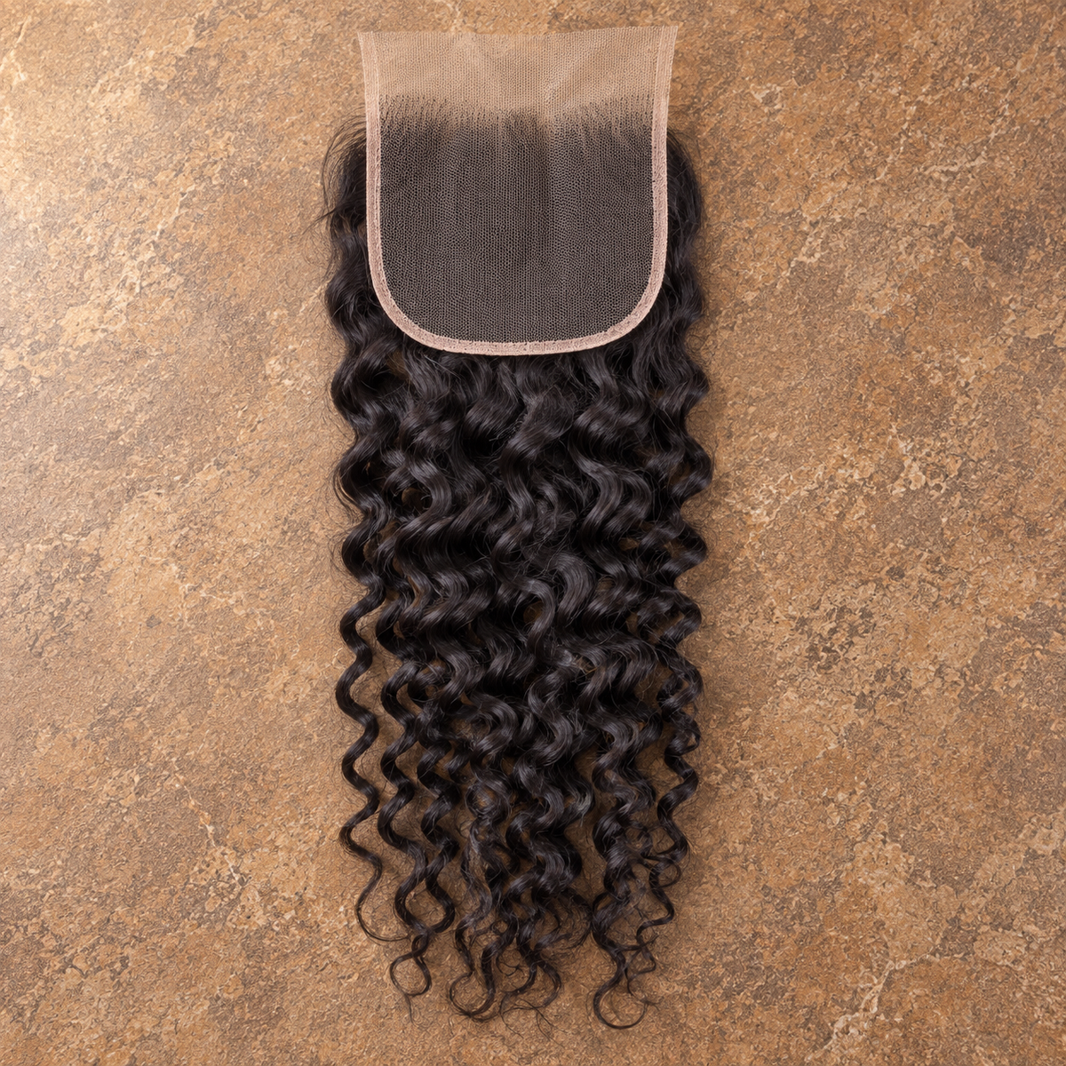 Multi-donor Burmese Curly lace closure on brown stone