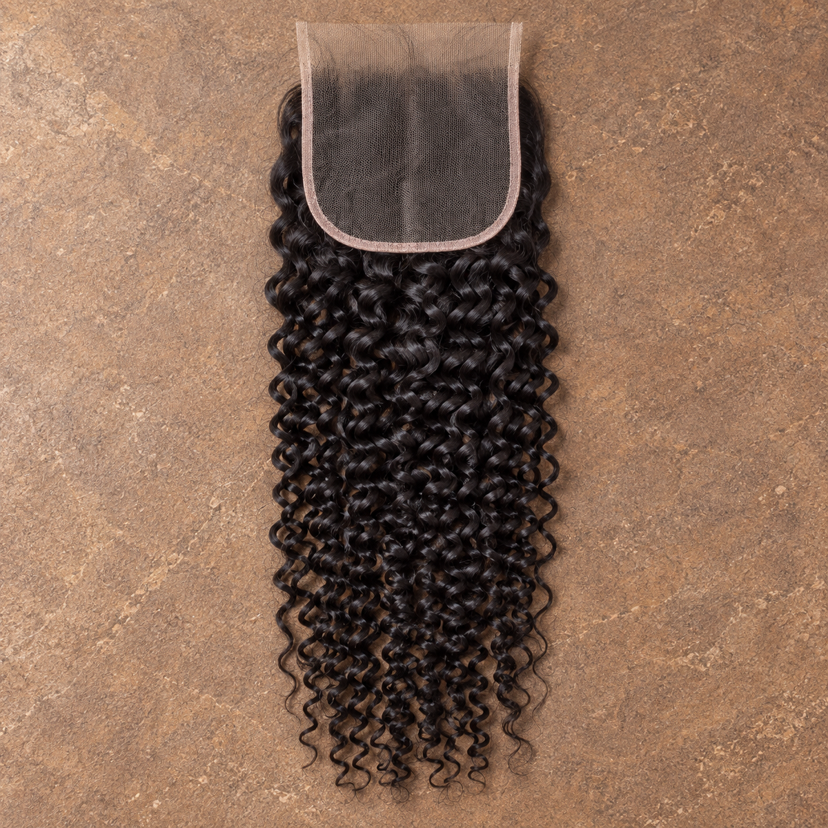 Multi-donor Deep Curly lace closure on brown stone