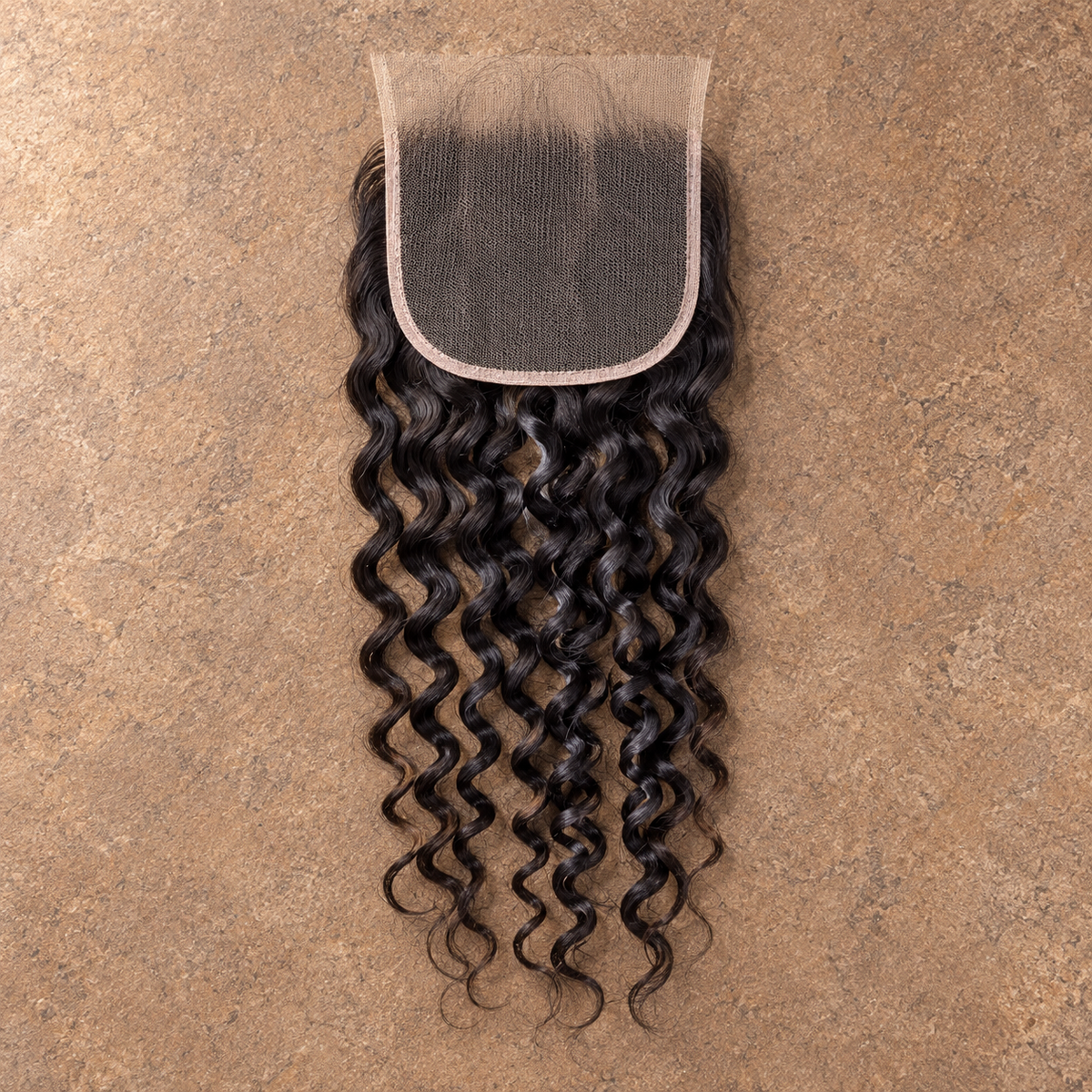 Multi-donor Italian Curly lace closure on brown stone